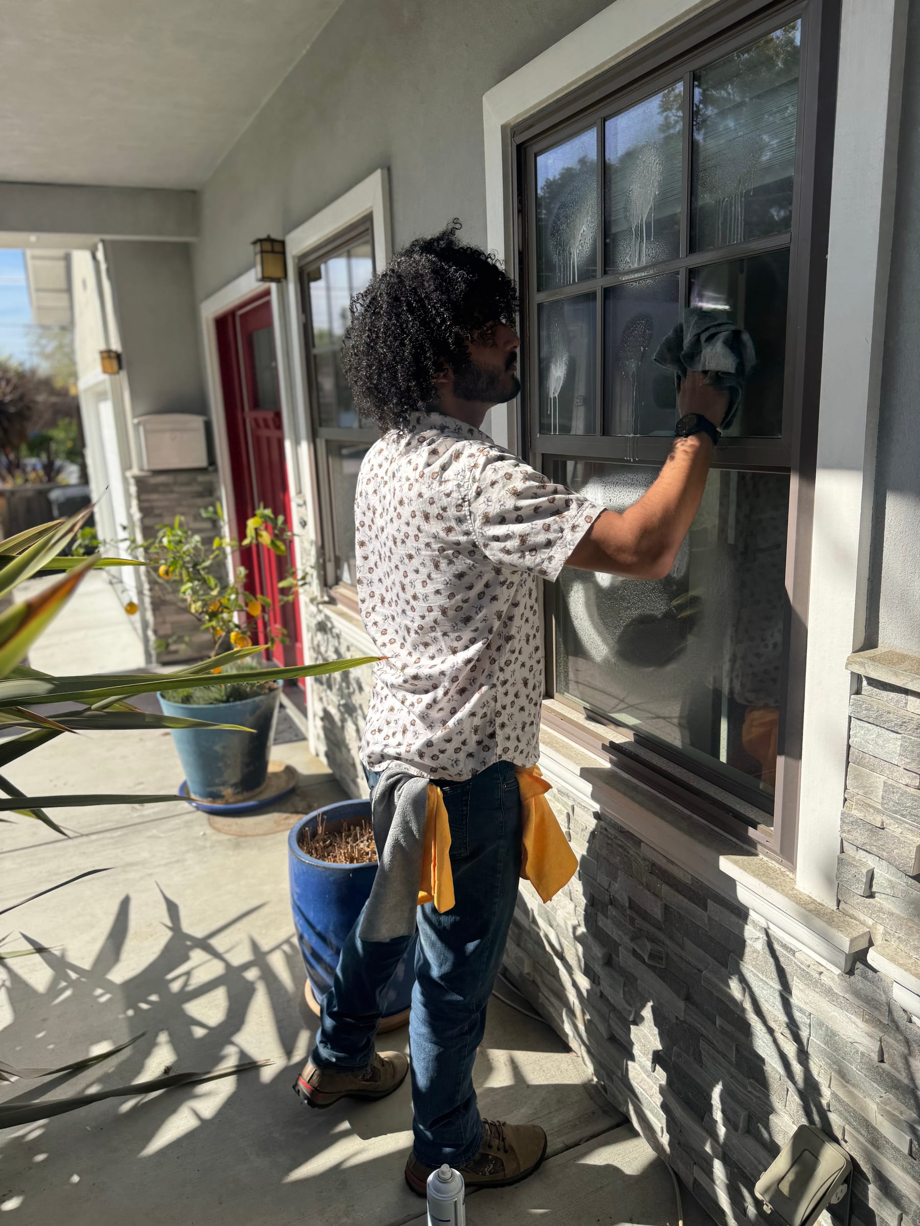 Cleaning exterior window glass with a squeegee